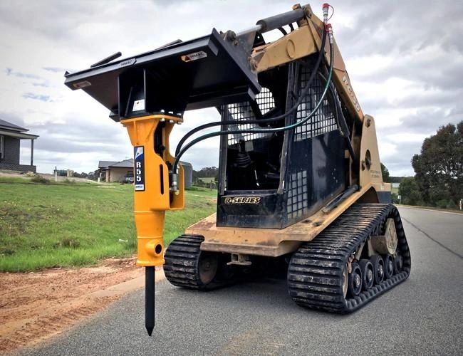 Hydraulic breaker attachment breaking concrete slab